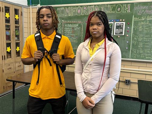  2 students standing
